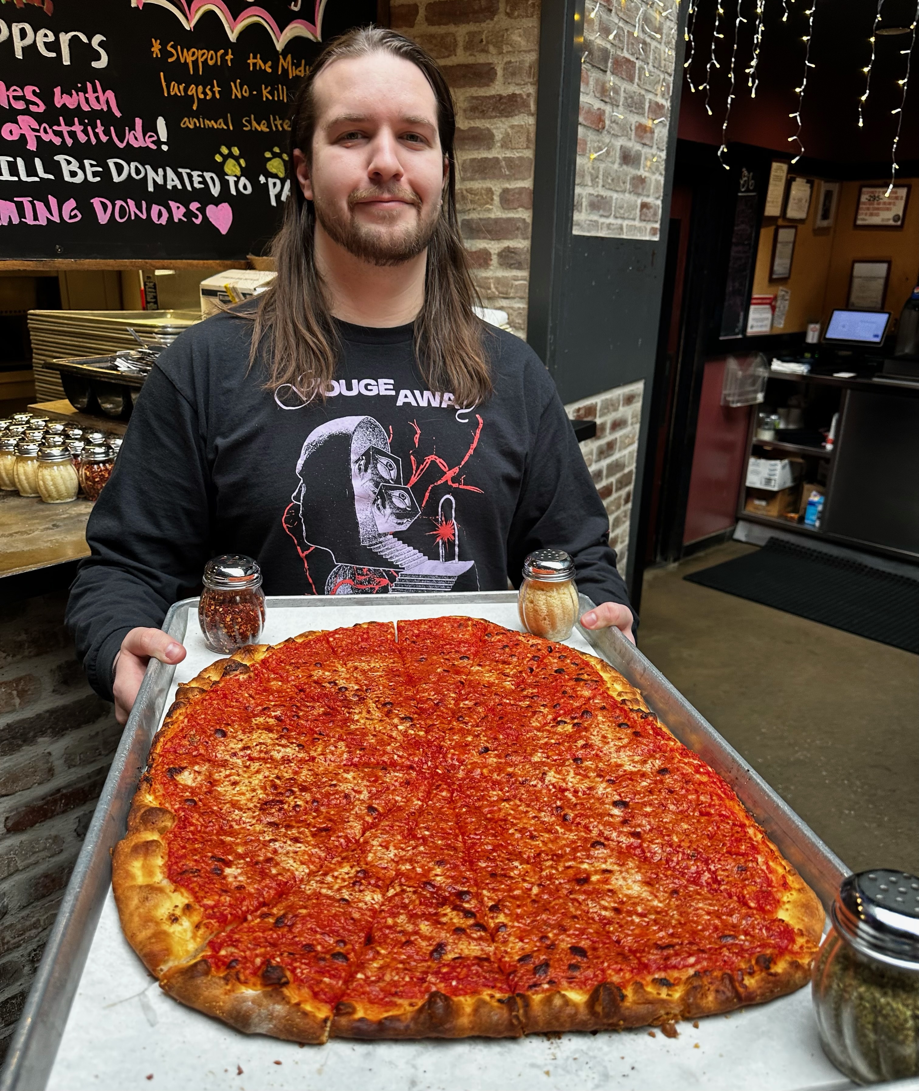 A group enjoying pizza at an independent Chicago pizzeria