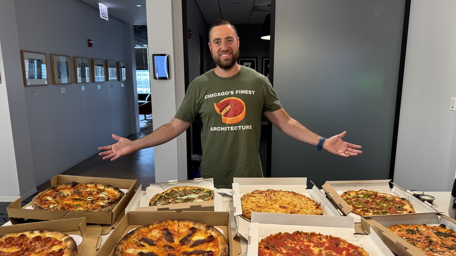 Jonathan Porter at the WGN Radio studio with pizzas from Robert's, Peanut Park, and Pizano's
